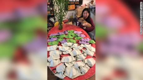 Kristina Wong of Los Angeles, CA poses with her first batch of masks made for a fire unit in NYC.